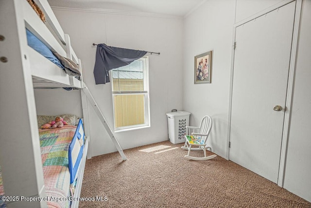 bedroom with crown molding and carpet