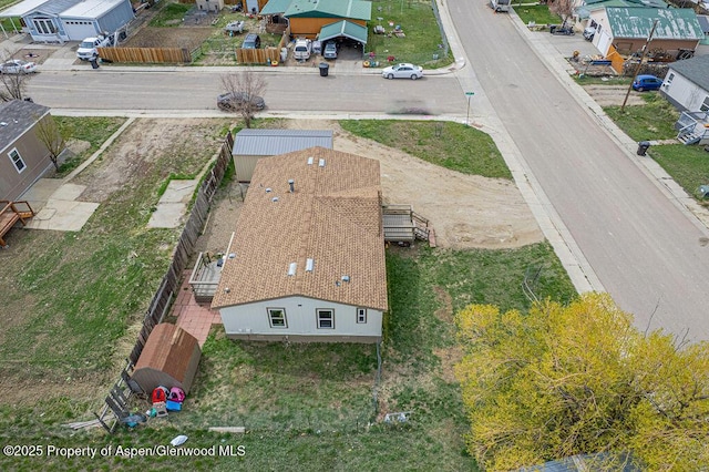 birds eye view of property with a residential view