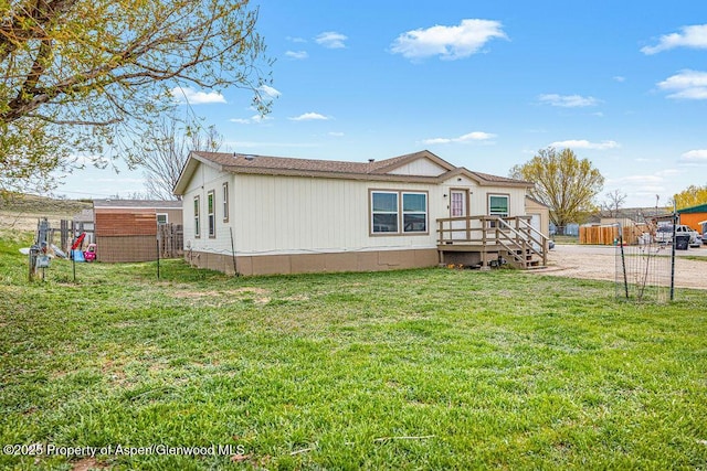 exterior space featuring a yard and fence