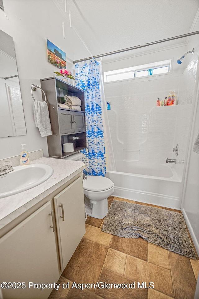 bathroom featuring shower / bath combo with shower curtain, toilet, and vanity