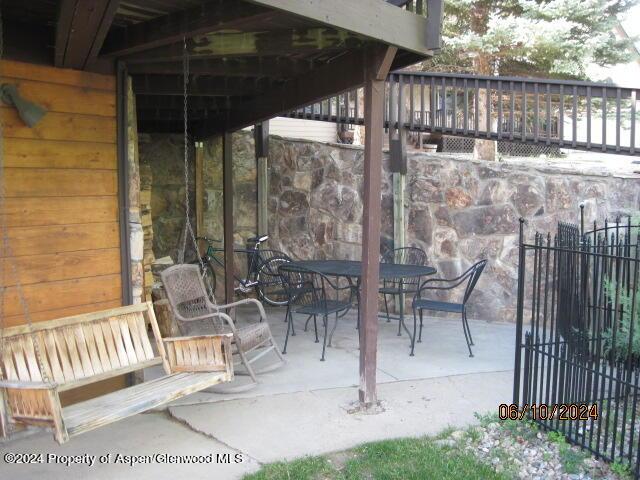 view of patio / terrace with outdoor dining space and fence