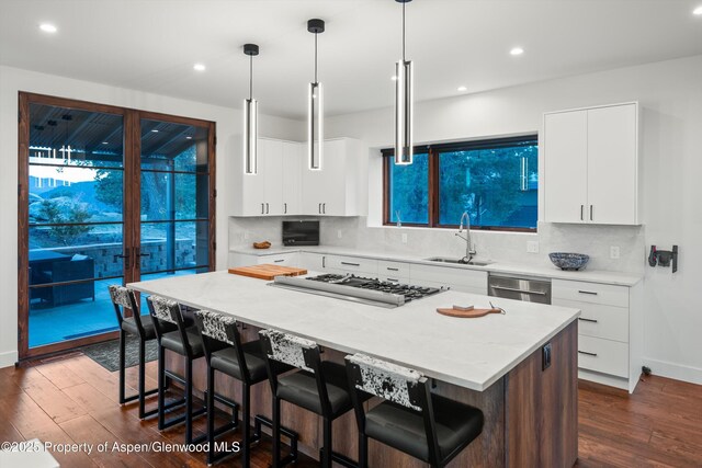 1108 County Road 110, Glenwood Springs, CO 81601 - kitchen with a sink, appliances with stainless steel finishes, dark wood-style flooring, a kitchen bar, and recessed lighting