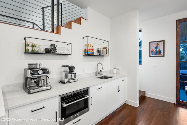 1108 County Road 110, Glenwood Springs, CO 81601 - indoor bar featuring stainless steel oven, dark wood-style floors, and baseboards