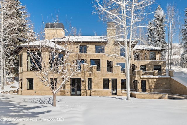 view of snow covered property