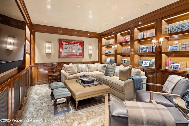 64 Pitkin Way, Aspen, CO 81611 - living area with built in features, wainscoting, a decorative wall, and crown molding