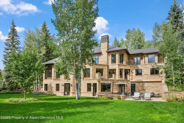 64 Pitkin Way, Aspen, CO 81611 - bedroom with carpet flooring, ornamental molding, multiple windows, and a high end fireplace