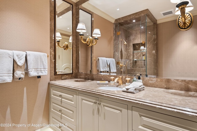 bathroom featuring ornamental molding, visible vents, vanity, and a shower stall