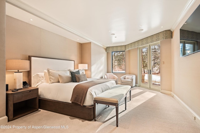 bedroom featuring access to exterior, light colored carpet, ornamental molding, and baseboards