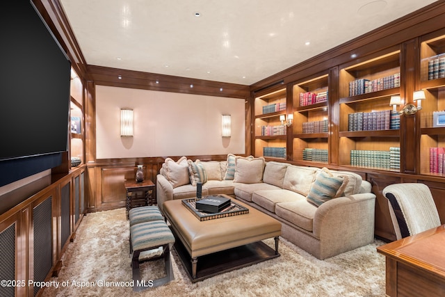 64 Pitkin Way, Aspen, CO 81611 - living area featuring carpet, a wainscoted wall, ornamental molding, a decorative wall, and built in features
