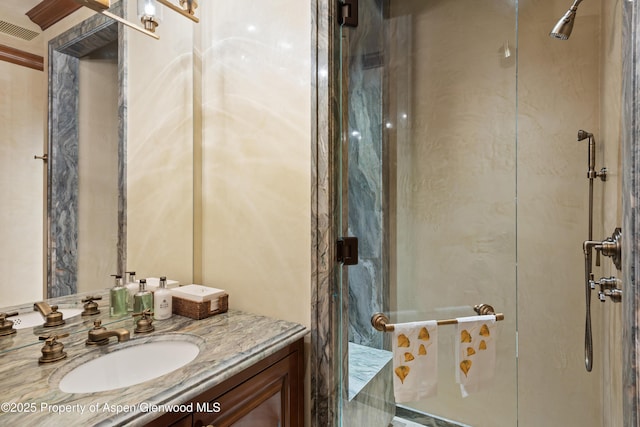 64 Pitkin Way, Aspen, CO 81611 - bathroom with vanity, visible vents, and a stall shower