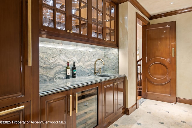 64 Pitkin Way, Aspen, CO 81611 - bar featuring a sink, wet bar, tasteful backsplash, baseboards, and beverage cooler