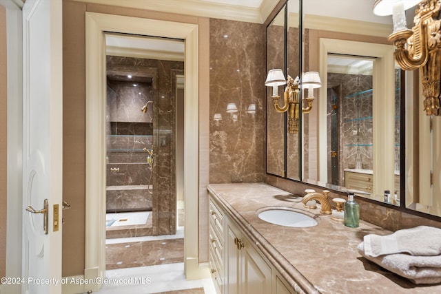 bathroom featuring crown molding and vanity