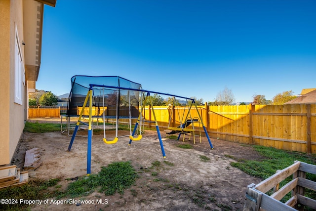 view of playground featuring a trampoline