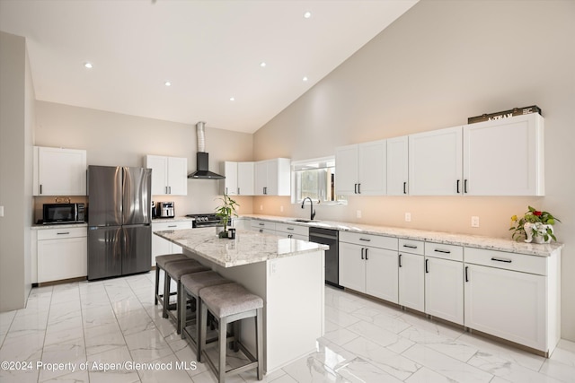 kitchen with sink, black appliances, white cabinetry, high vaulted ceiling, and a kitchen island