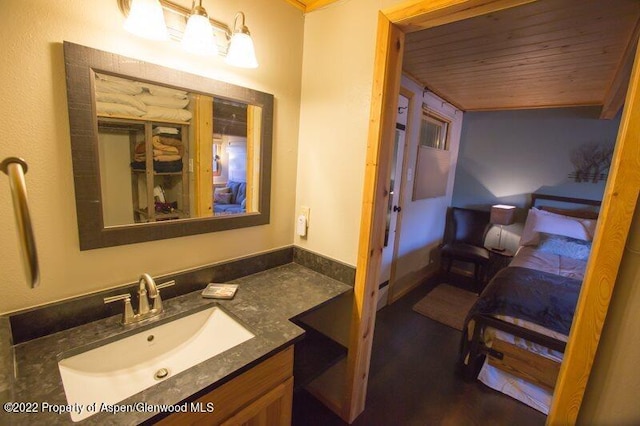 bathroom with vanity and wooden ceiling