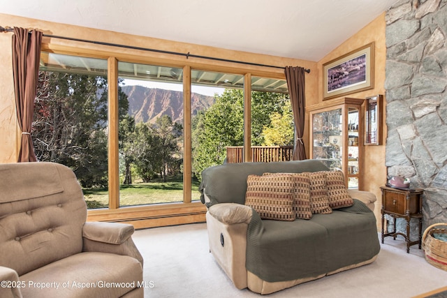 172 Sunny Acres Rd, Glenwood Springs, CO 81601 - carpeted living area with a mountain view, vaulted ceiling, and a baseboard heating unit