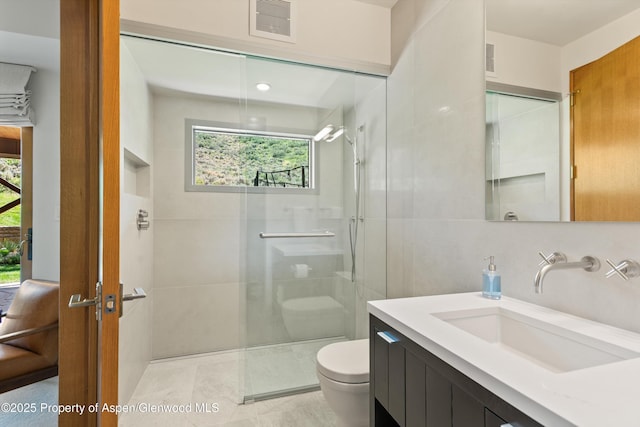 1000 Lazy O Rd, Snowmass, CO 81654 - bathroom with toilet, a shower with door, visible vents, and a wealth of natural light