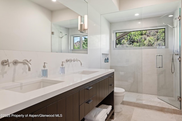 1000 Lazy O Rd, Snowmass, CO 81654 - bathroom with a sink, a shower stall, toilet, and double vanity