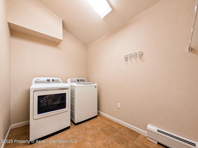 612 Riverview Dr Unit 808, New Castle, CO 81647 - laundry room with a baseboard radiator, washer and dryer, light tile patterned floors, and baseboards