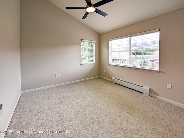 612 Riverview Dr Unit 808, New Castle, CO 81647 - carpeted spare room featuring a baseboard heating unit, ceiling fan, lofted ceiling, and baseboards
