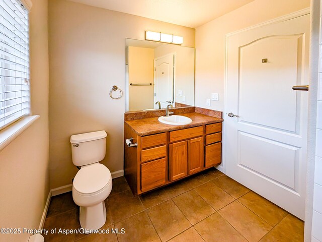 612 Riverview Dr Unit 808, New Castle, CO 81647 - bathroom with tile patterned floors, toilet, and vanity