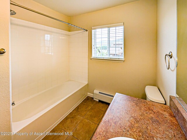 612 Riverview Dr Unit 808, New Castle, CO 81647 - full bathroom featuring baseboard heating, tile patterned flooring, toilet, washtub / shower combination, and baseboards