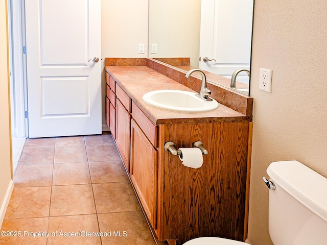 612 Riverview Dr Unit 808, New Castle, CO 81647 - half bathroom featuring toilet, tile patterned floors, and vanity