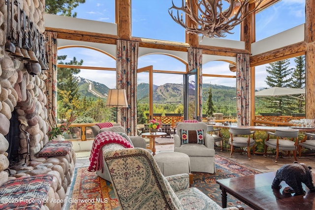 87 Magnifico Dr, Aspen, CO 81611 - sunroom with a mountain view, plenty of natural light, and a chandelier
