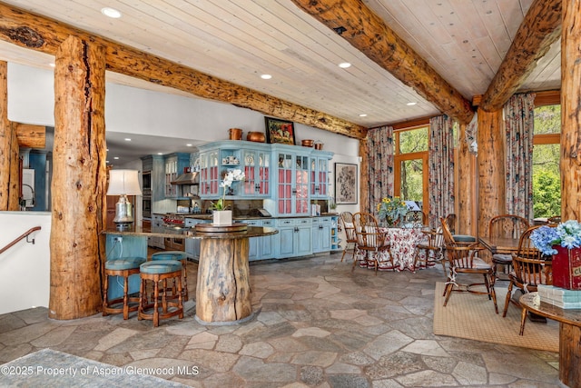 87 Magnifico Dr, Aspen, CO 81611 - bar area with stone tile floors, recessed lighting, healthy amount of natural light, and a wooden ceiling with exposed beams