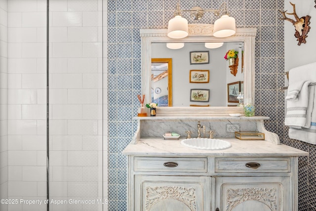 87 Magnifico Dr, Aspen, CO 81611 - bathroom featuring vanity and decorative backsplash
