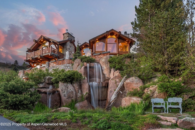 87 Magnifico Dr, Aspen, CO 81611 - view of front of house featuring a balcony and a chimney