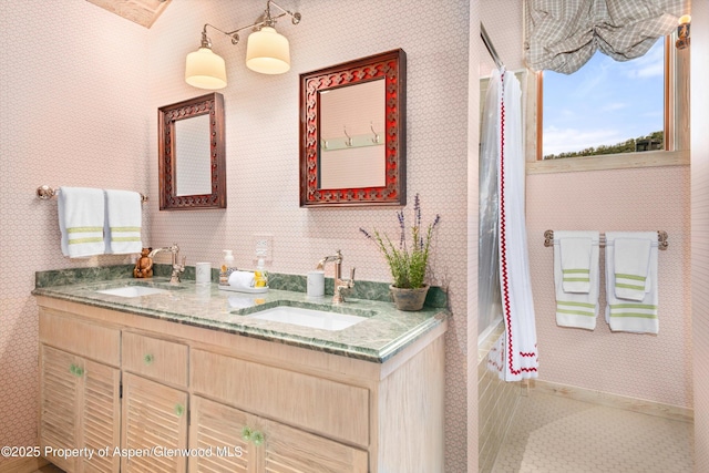 87 Magnifico Dr, Aspen, CO 81611 - full bathroom featuring wallpapered walls, double vanity, and shower / bath combo with shower curtain