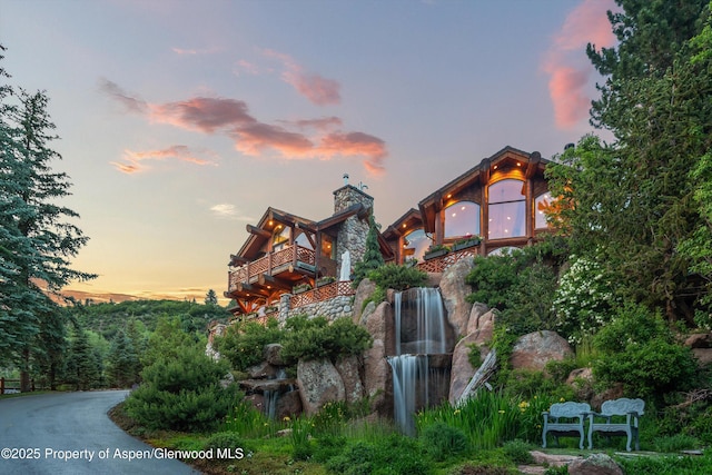 87 Magnifico Dr, Aspen, CO 81611 - view of property exterior featuring a balcony and a chimney