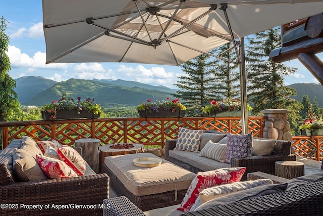 87 Magnifico Dr, Aspen, CO 81611 - wooden terrace featuring an outdoor living space with a fire pit and a mountain view