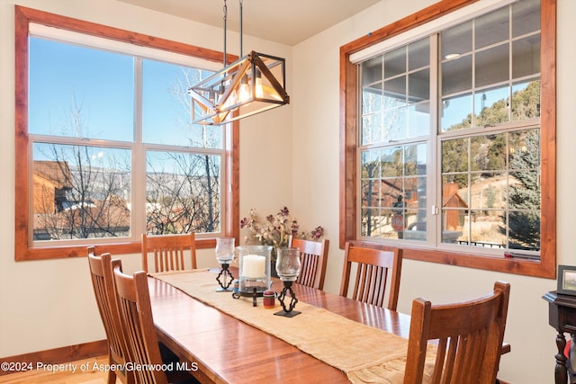 dining space featuring a notable chandelier