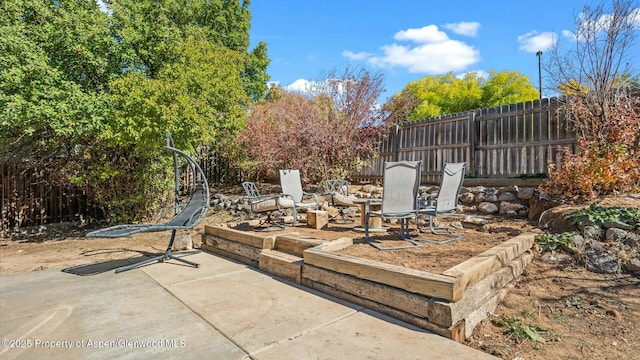 view of patio / terrace featuring fence