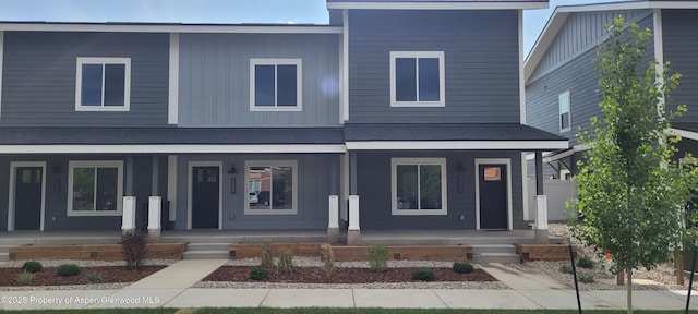 754 Tucker St, Craig, CO 81625 - view of front facade with covered porch and board and batten siding