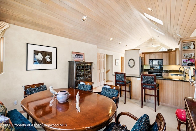 333 W Hopkins Ave, Aspen, CO 81611 - dining space with vaulted ceiling with skylight, a ceiling fan, wood ceiling, and light carpet