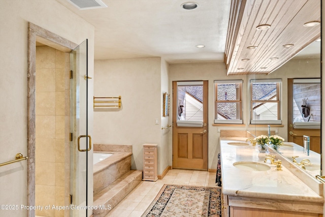 333 W Hopkins Ave, Aspen, CO 81611 - bathroom with recessed lighting, tile patterned flooring, double vanity, a sink, and a bath