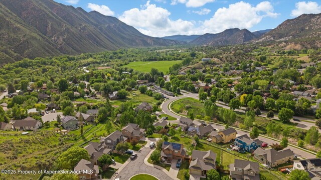 150 Castle Ct, New Castle, CO 81647 - view of property location featuring a mountain backdrop and nearby suburban area