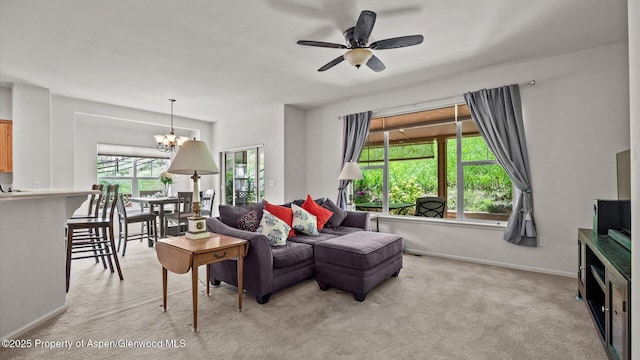 150 Castle Ct, New Castle, CO 81647 - living area with light colored carpet, ceiling fan, and a chandelier