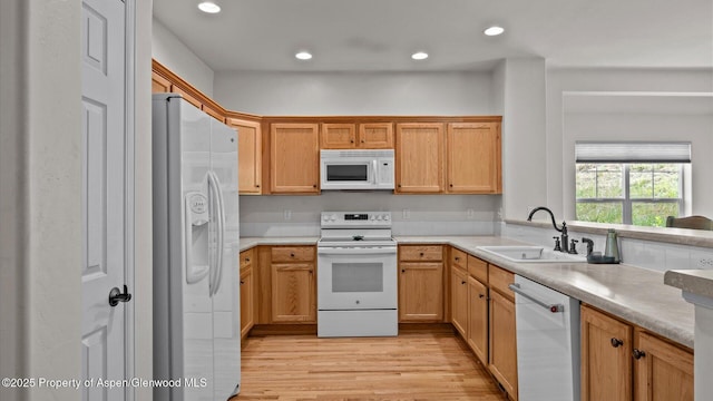 150 Castle Ct, New Castle, CO 81647 - kitchen with white appliances, light wood-type flooring, light countertops, and recessed lighting