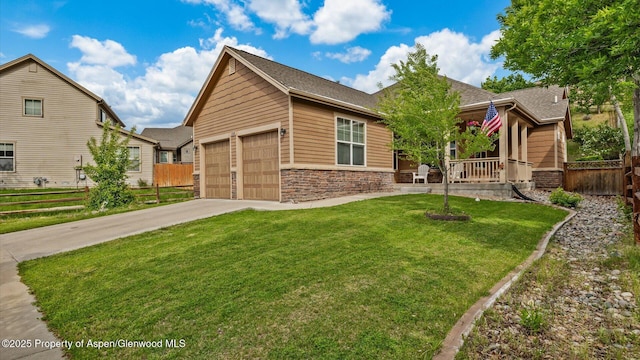 150 Castle Ct, New Castle, CO 81647 - view of front facade with stone siding, driveway, covered porch, a garage, and a shingled roof