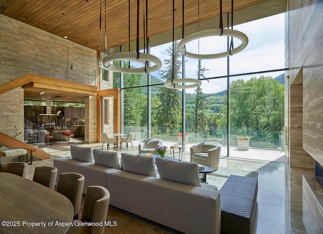 102 Wood Duck Ln, Aspen, CO 81611 - lobby featuring a towering ceiling, floor to ceiling windows, and wooden ceiling