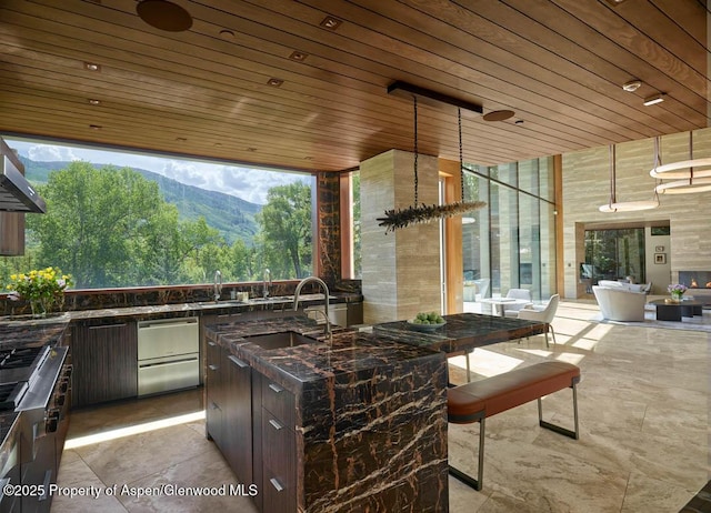 102 Wood Duck Ln, Aspen, CO 81611 - view of patio featuring an outdoor kitchen and a mountain view