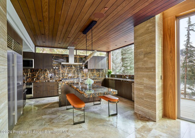 interior space with sink and wood ceiling