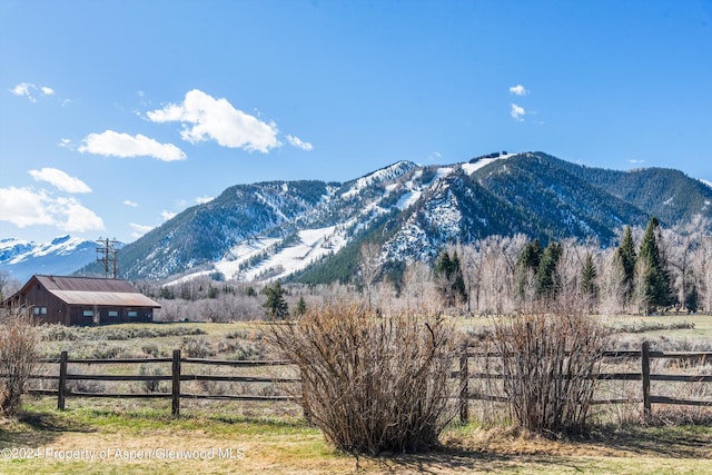 mountain view featuring a rural view