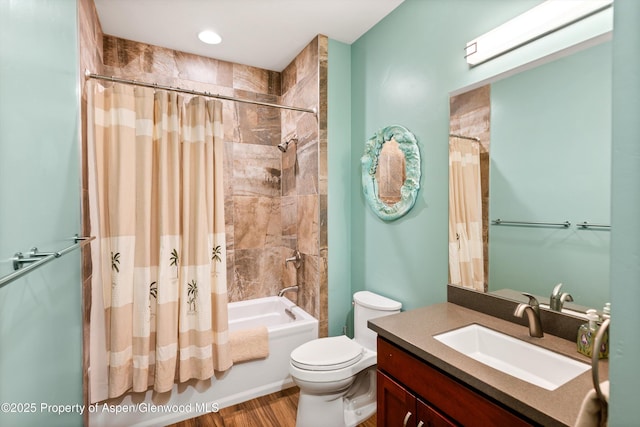 bathroom with toilet, shower / bath combo with shower curtain, and vanity