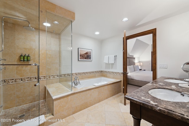 bathroom with sink, independent shower and bath, and tile patterned flooring