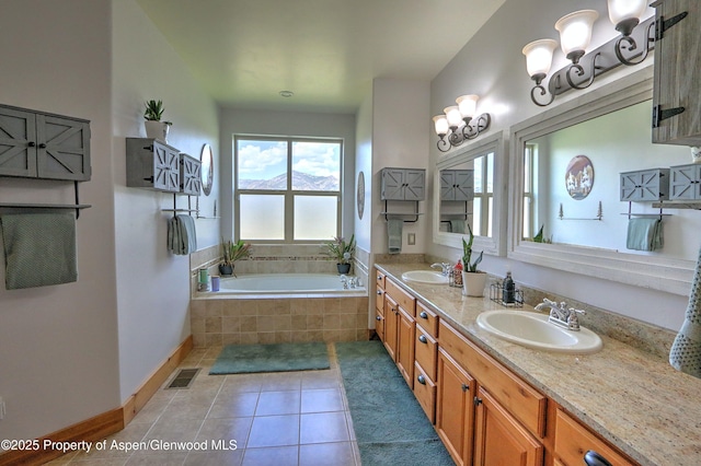369 N Meadow Dr, Rifle, CO 81650 - full bath with a garden tub, tile patterned floors, and double vanity